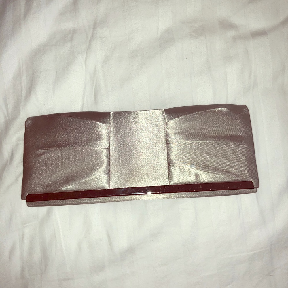 Jessica McClintock silver satin evening clutch.